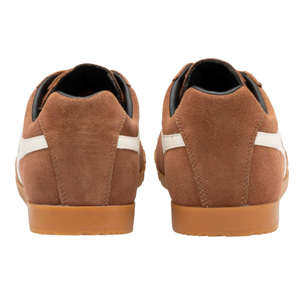 Rear view of two brown suede trainers with white stripes and tan soles