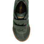 Top-down view of a dark green suede trainer with two hook-and-loop straps and a gum sole