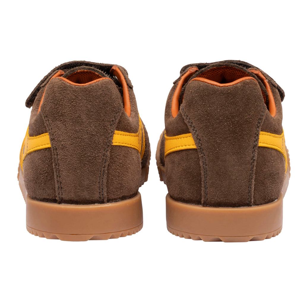 Pair of brown suede trainers with yellow stripes and tan soles, rear view