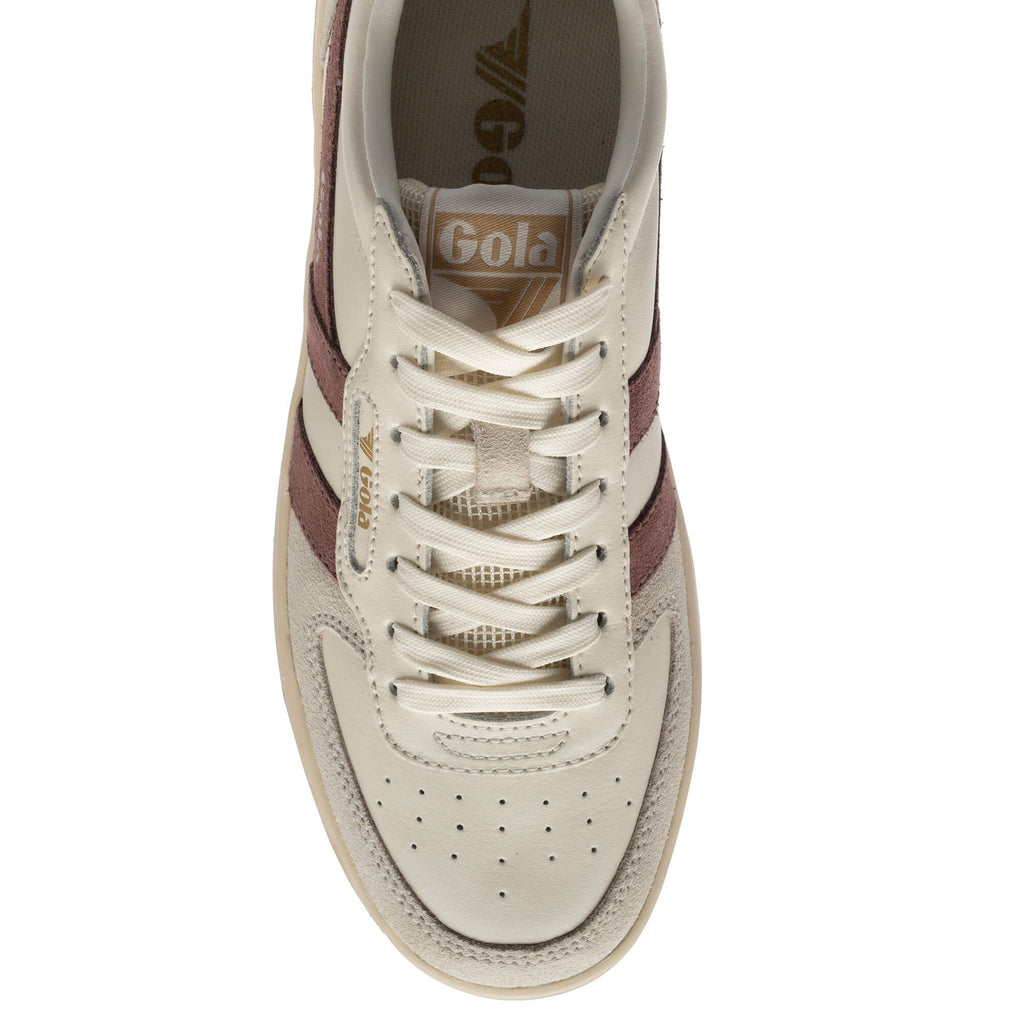 Close up of a Gola trainer in off-white with burgundy stripes and laces