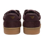 Rear view of two burgundy suede trainers with tan soles and a gold logo on the heel