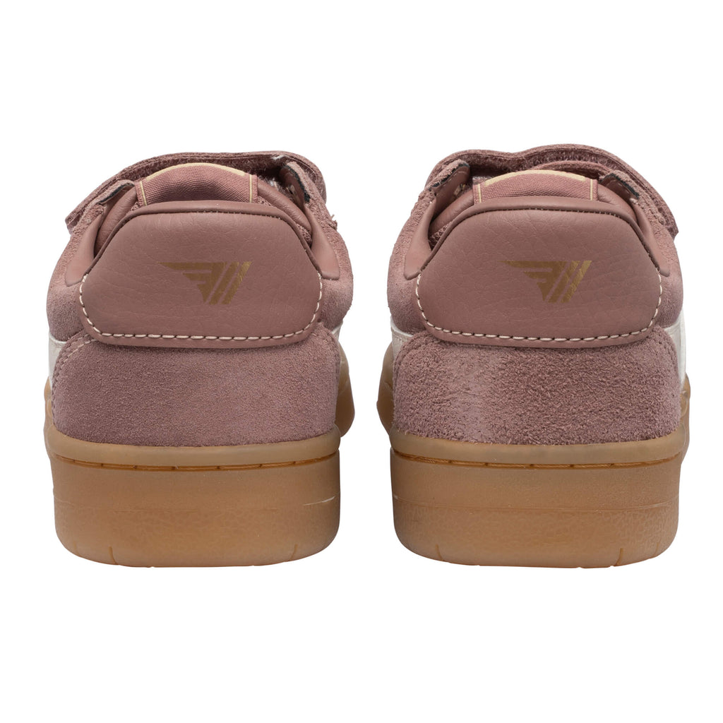 Pair of pink suede trainers with brown soles, rear view