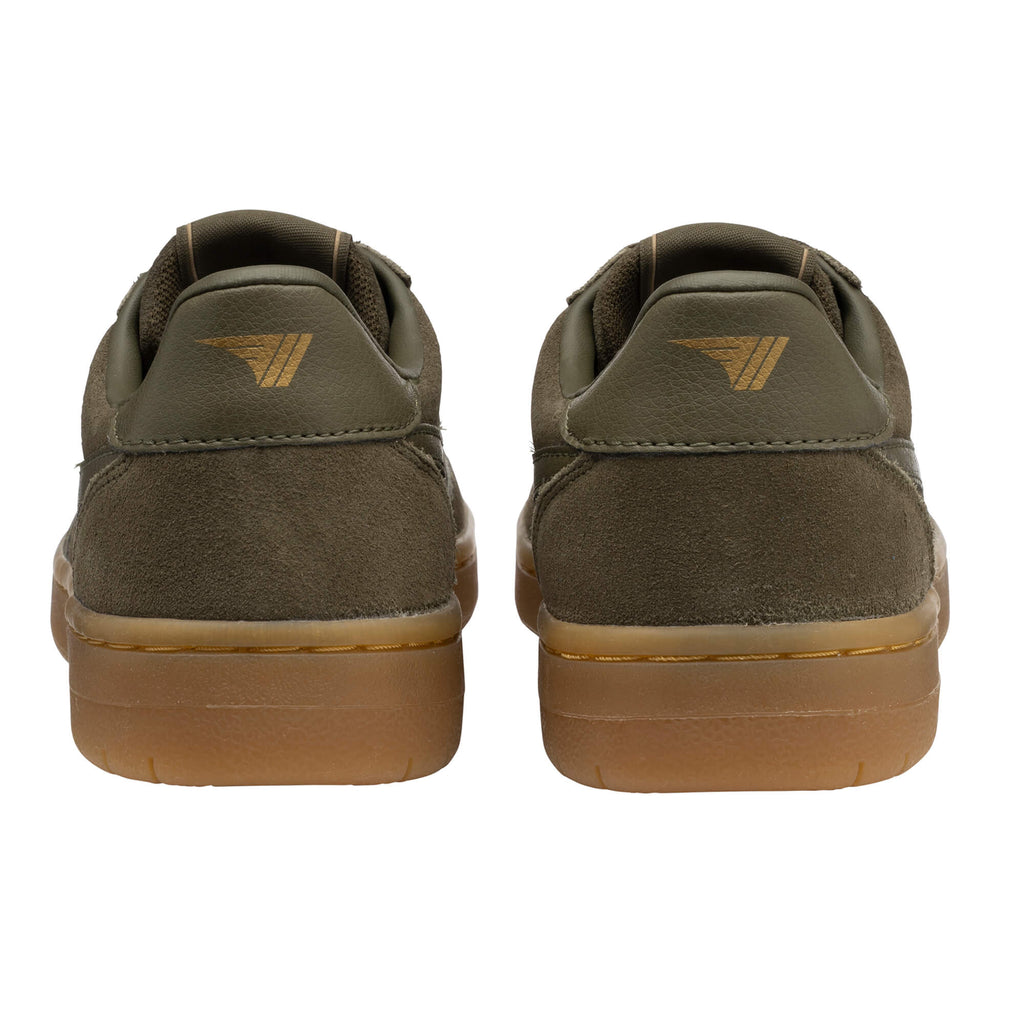 Pair of khaki green suede trainers with brown soles, rear view