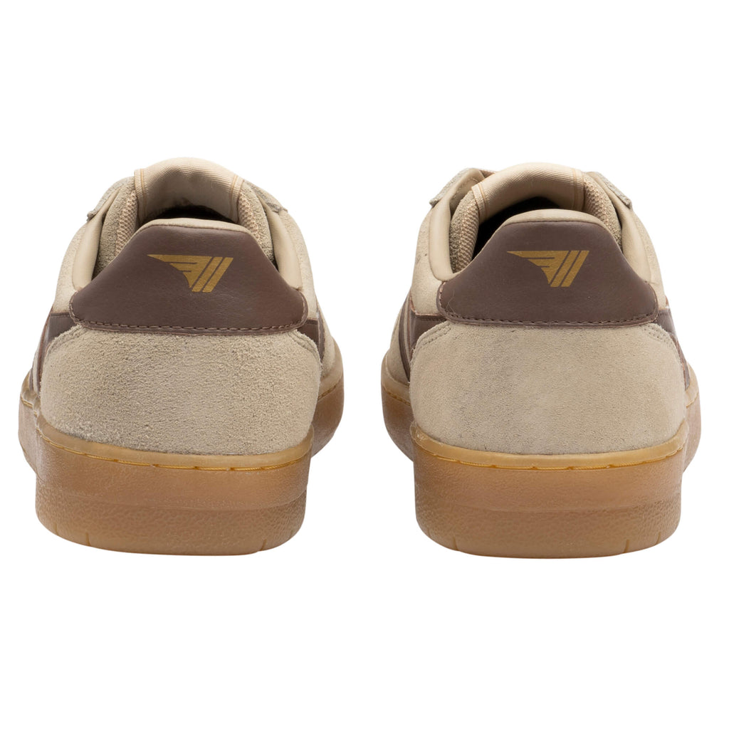 Rear view of two beige suede trainers with brown heel tabs and gum soles