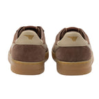 Pair of brown suede trainers with beige heel tabs and gum soles, rear view
