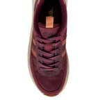 Top-down view of a burgundy Gola trainer with peach accents and cream sole