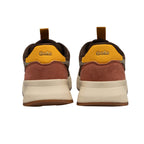 Rear view of two Gola trainers in brown, mustard, and rust with cream soles