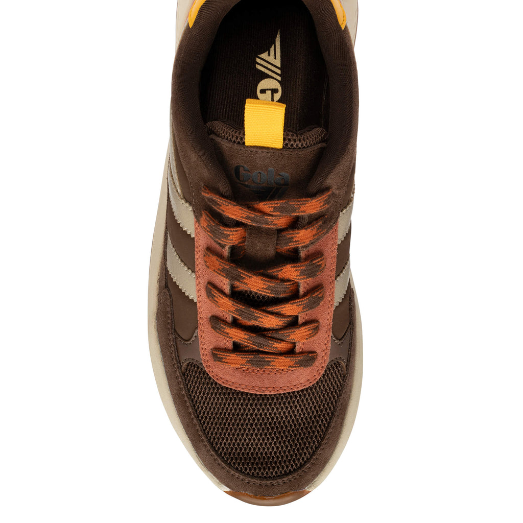 Top-down view of a brown Gola trainer with orange laces and a yellow pull tab