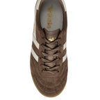 Top-down view of a brown suede Gola trainer with white stripes and brown laces