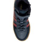 Navy blue and red high-top trainer with laces and a velcro strap