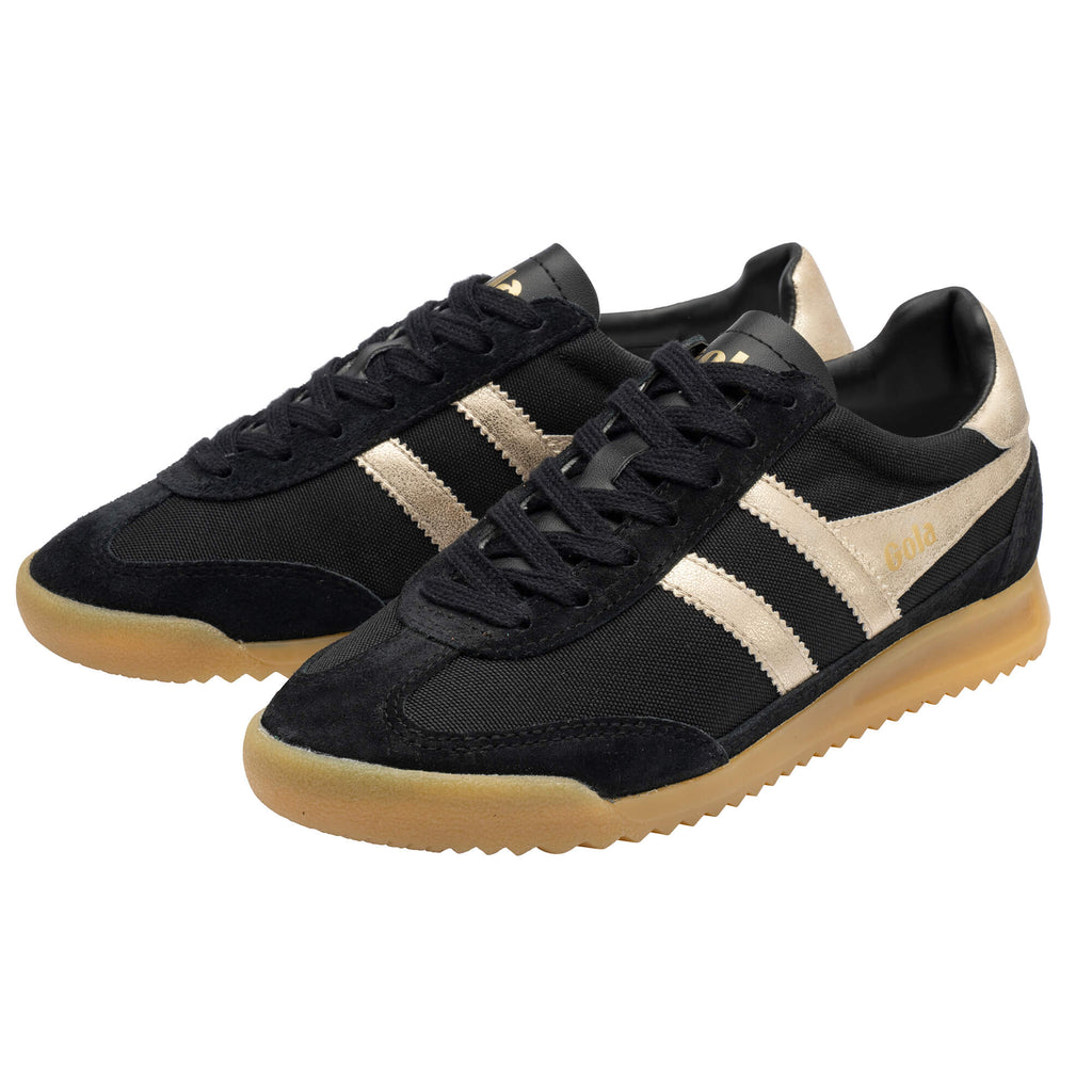 Pair of black and gold Gola Harrier trainers with gum soles