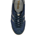 Overhead view of a navy blue Gola trainer with grey stripes and a brown sole