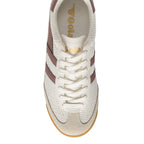 Top-down view of a white Gola trainer with brown stripes and white laces