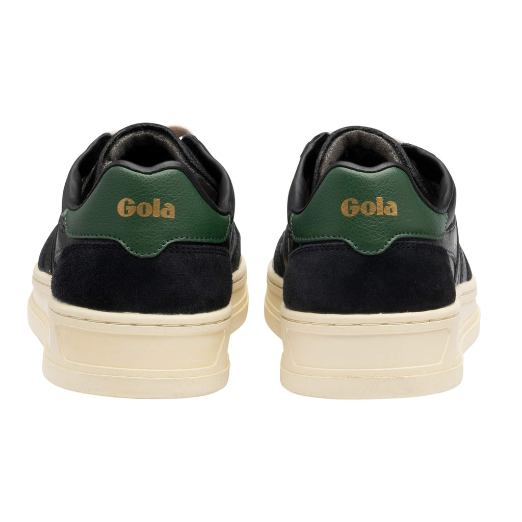 Pair of black Gola trainers with green heel tabs and cream soles, rear view