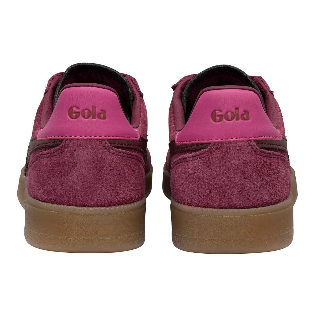 Pair of Gola trainers, back view. Burgundy suede with pink heel tab and Gola logo. Brown rubber sole