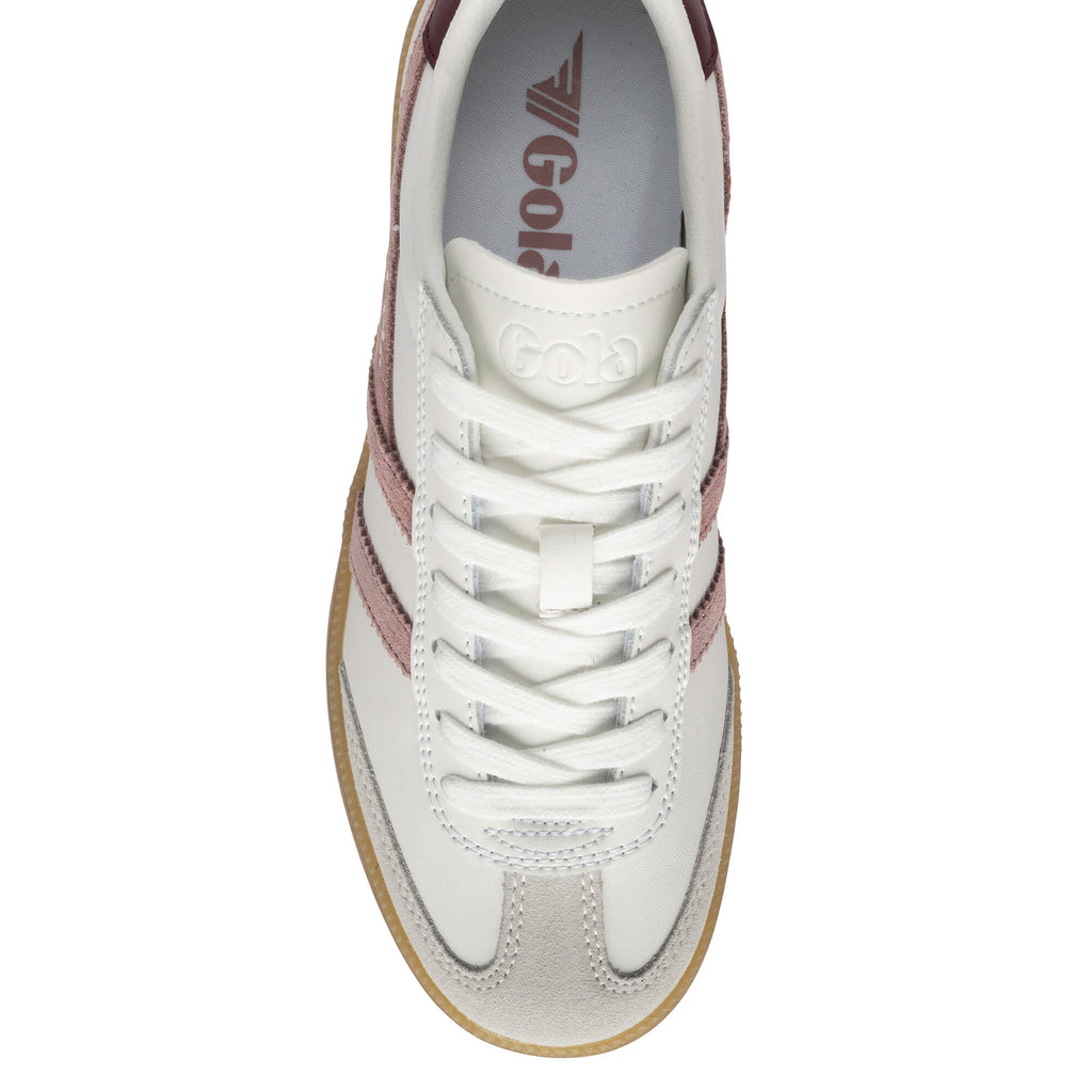 Top-down view of a white Gola trainer with pink stripes and a light brown sole