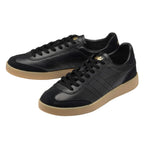 Pair of black Gola trainers with tan soles
