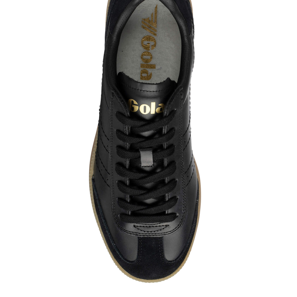 Black Gola Harrier trainers with gold Gola branding on the tongue and insole