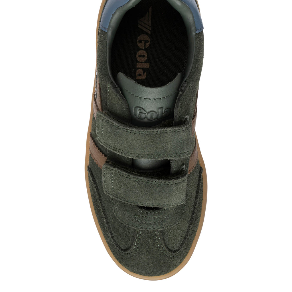 Top-down view of a dark green suede trainer with two hook-and-loop straps and a brown rubber sole